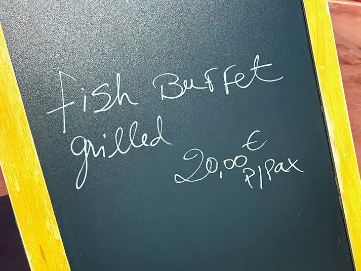 Faro e benfica grilled fish buffet sign showing 20 euros per person