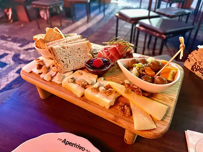 cheese and sausage board at aperitivo